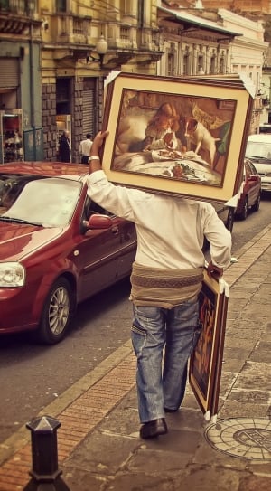 person painting and red chevrolet sedan thumbnail