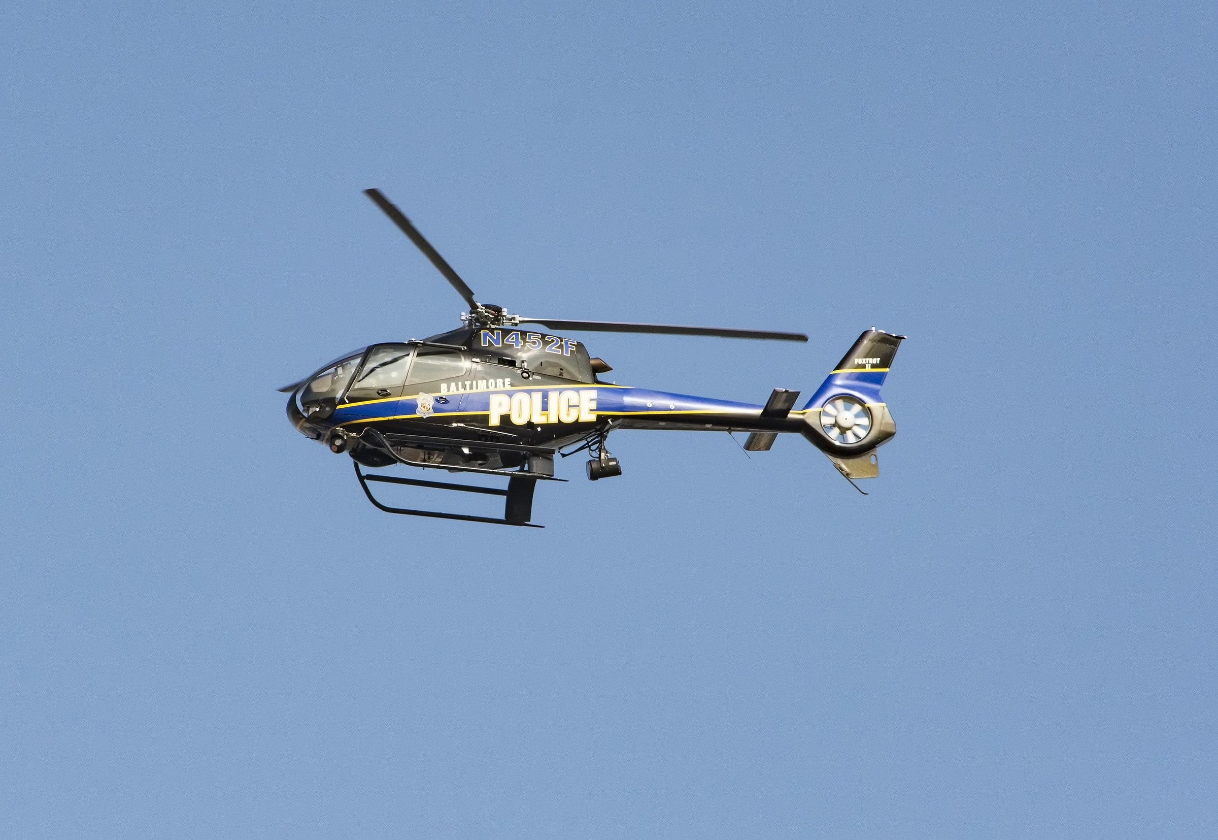 gray and blue police helicopter