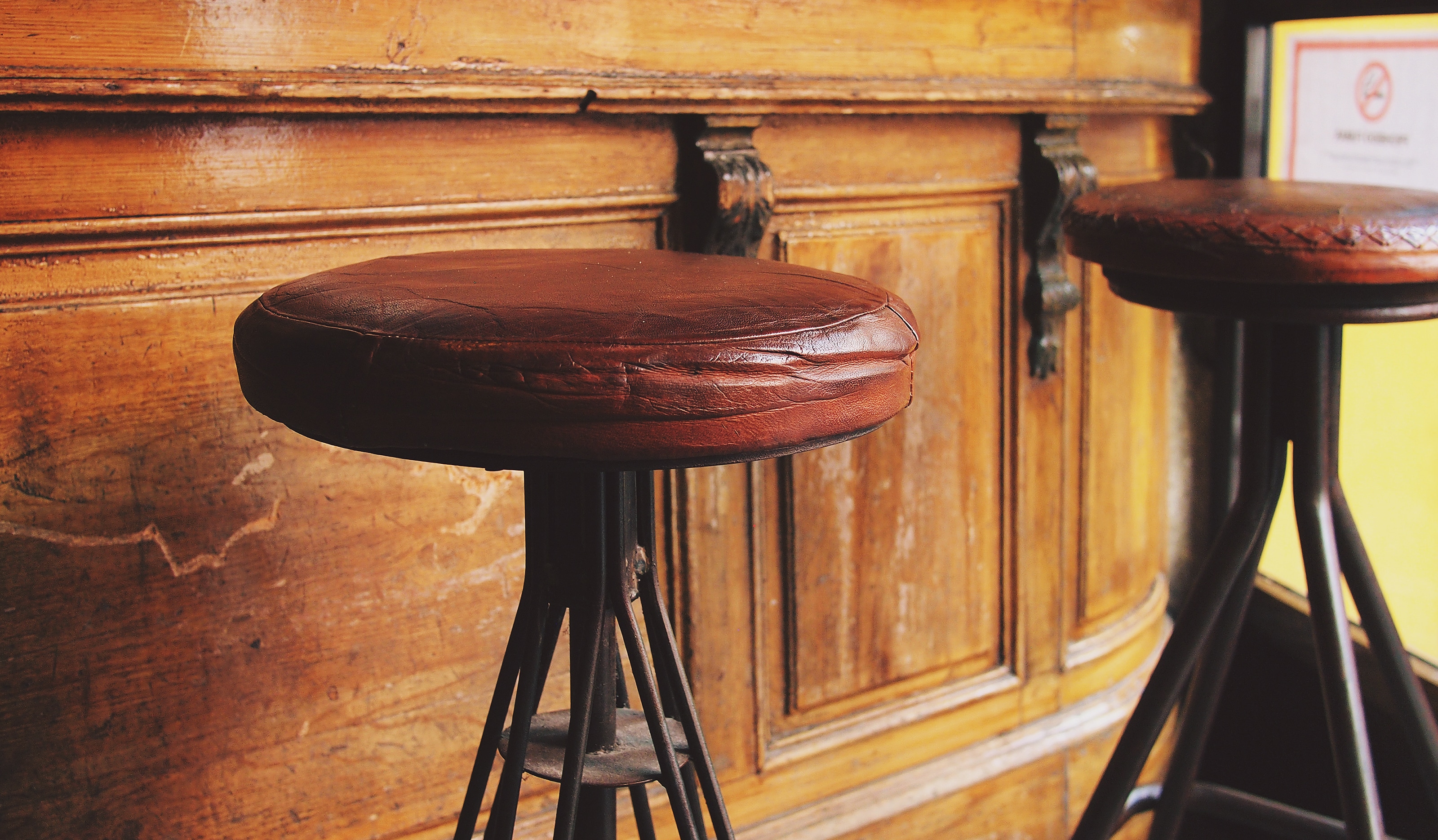 gray metal base brown leather round bar stool