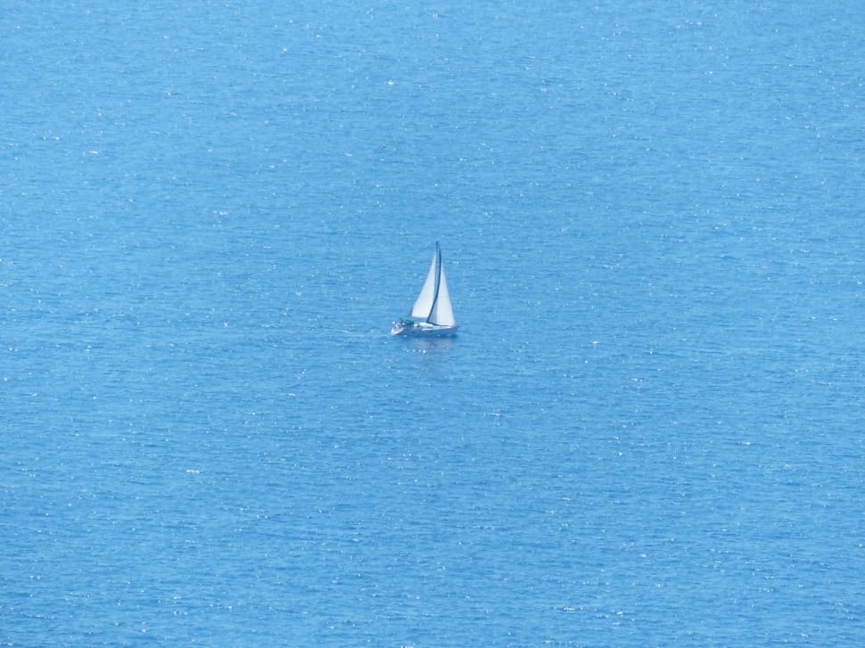 white sailboat on the sea during daytime preview
