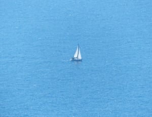 white sailboat on the sea during daytime thumbnail
