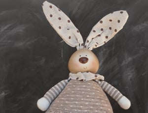 white brown and red rabbit toy thumbnail