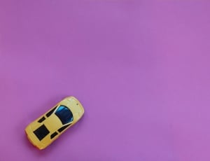 yellow sports coupe scale model thumbnail