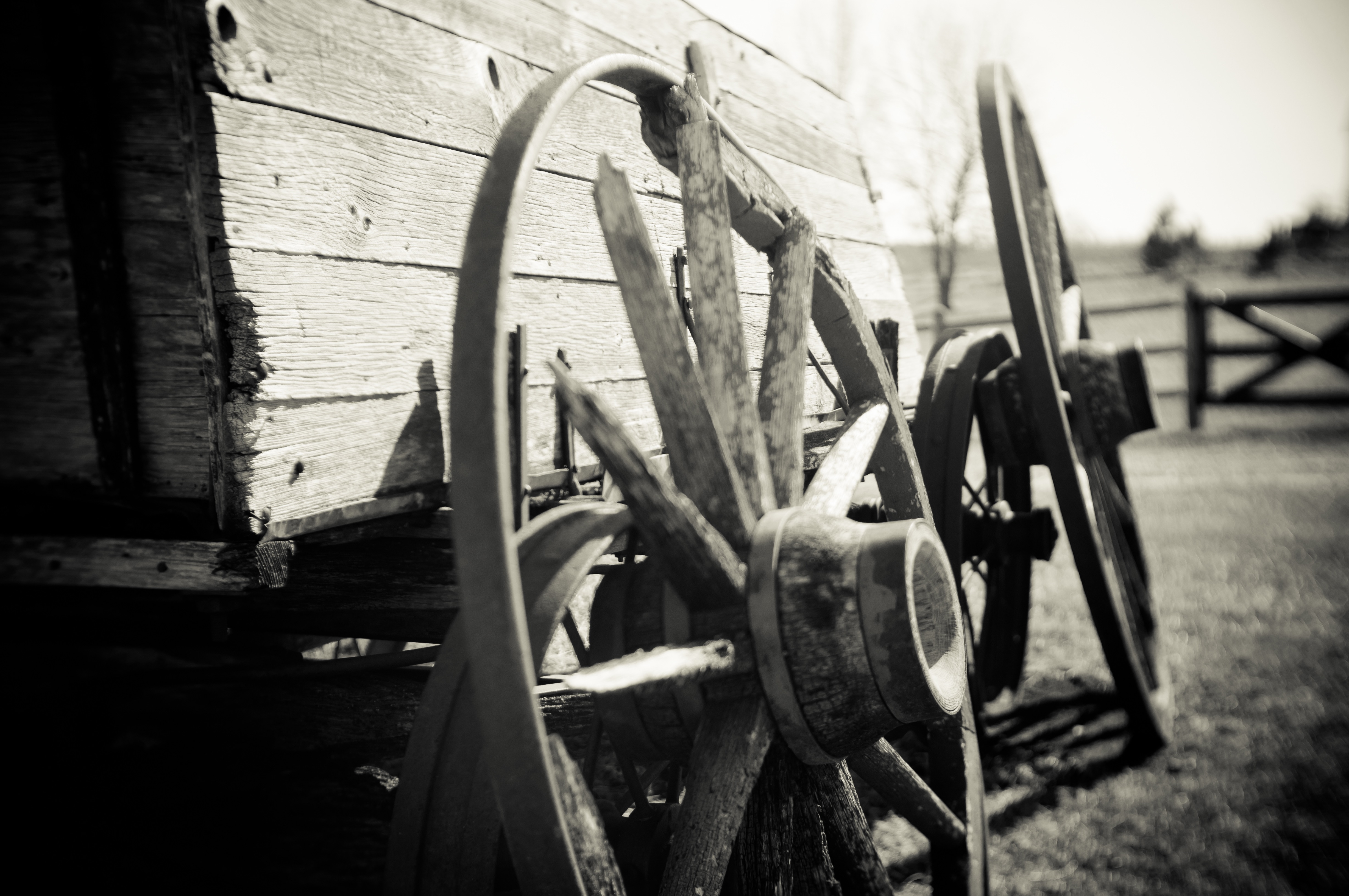 wagon wheel grayscale photo