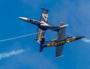 two white and blue preitling fighter planes thumbnail