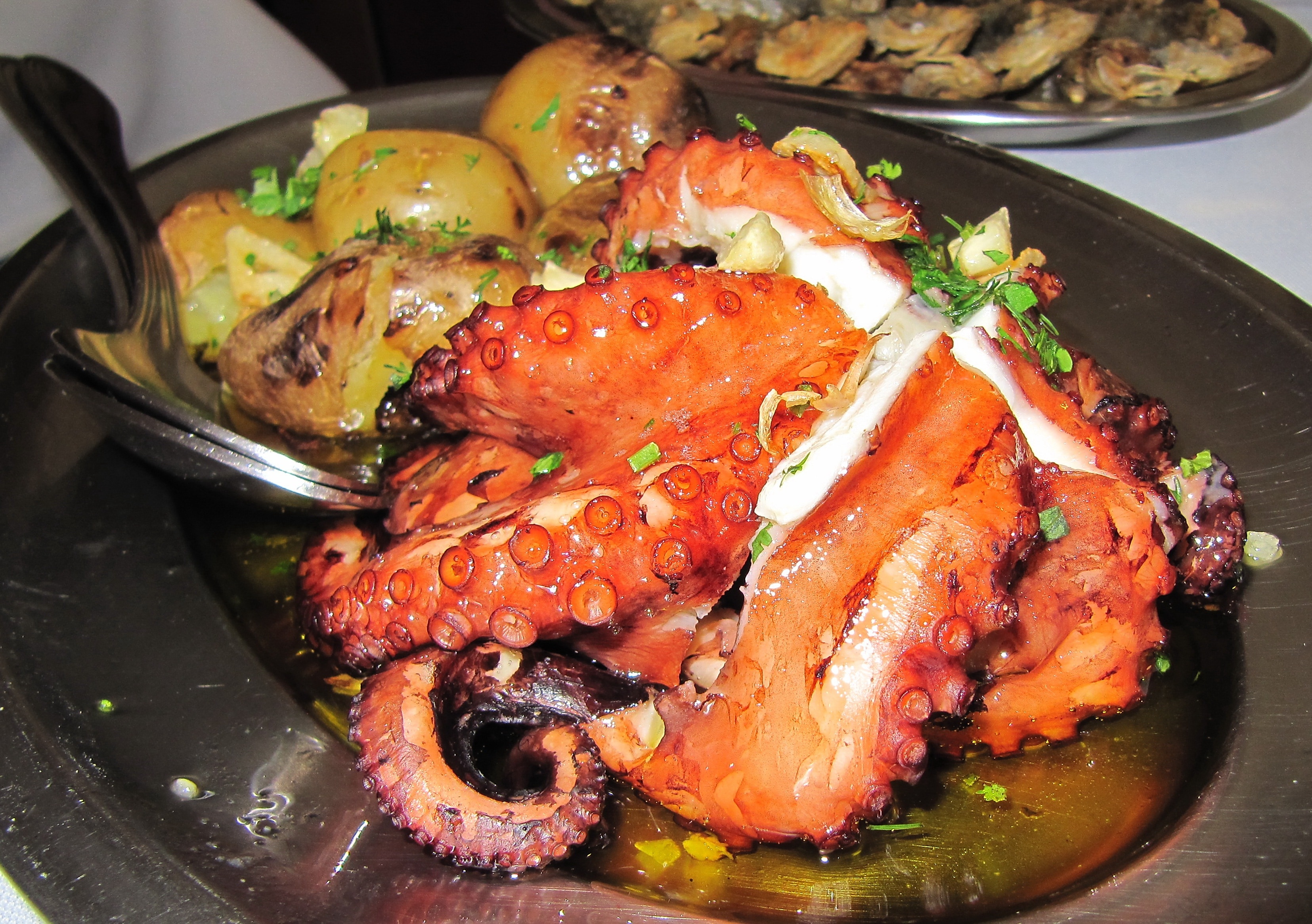 grilled sea food serving on black wooden plate