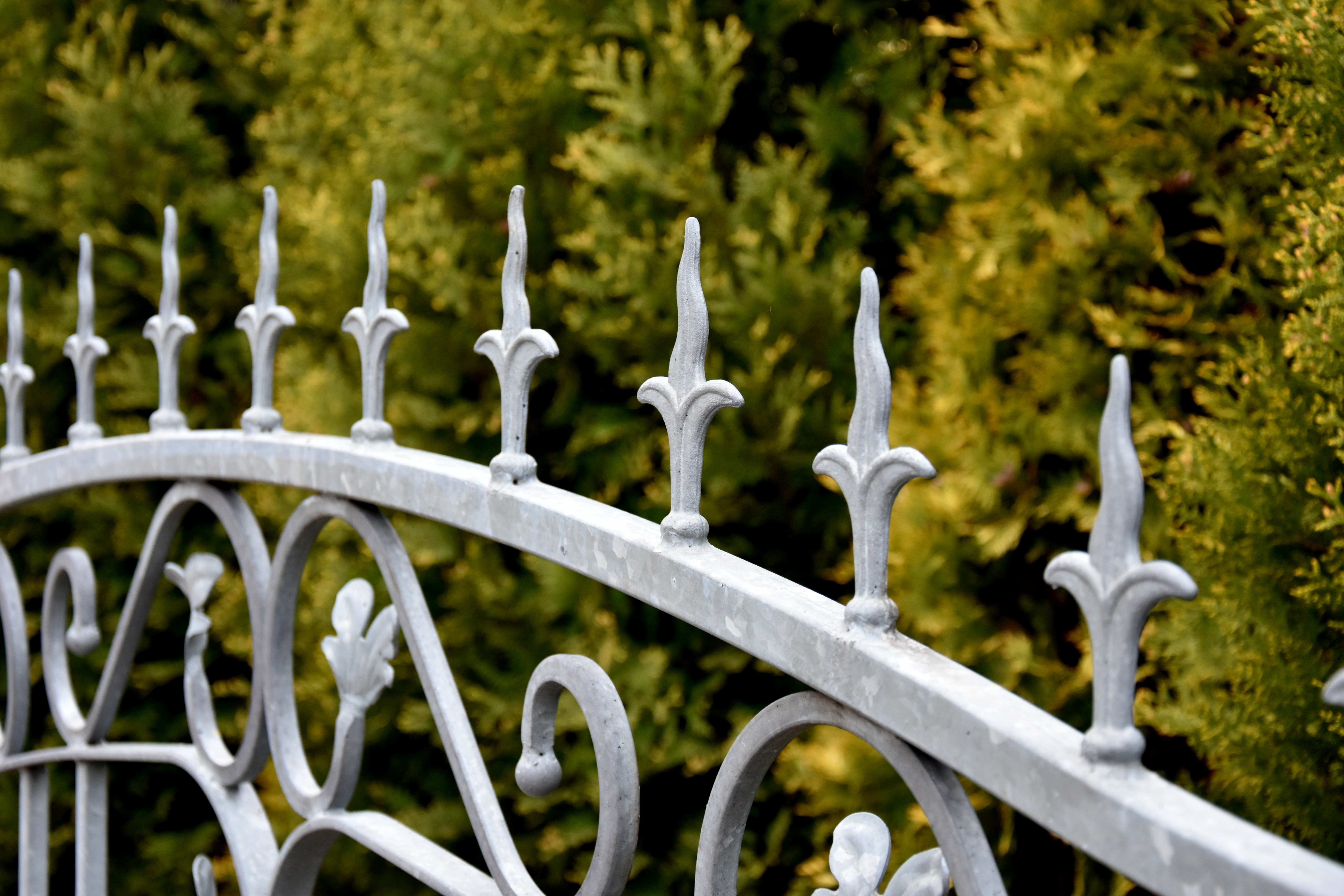 gray metal spiked frame security fence