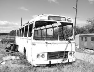 gray scale of white abandoned bus thumbnail