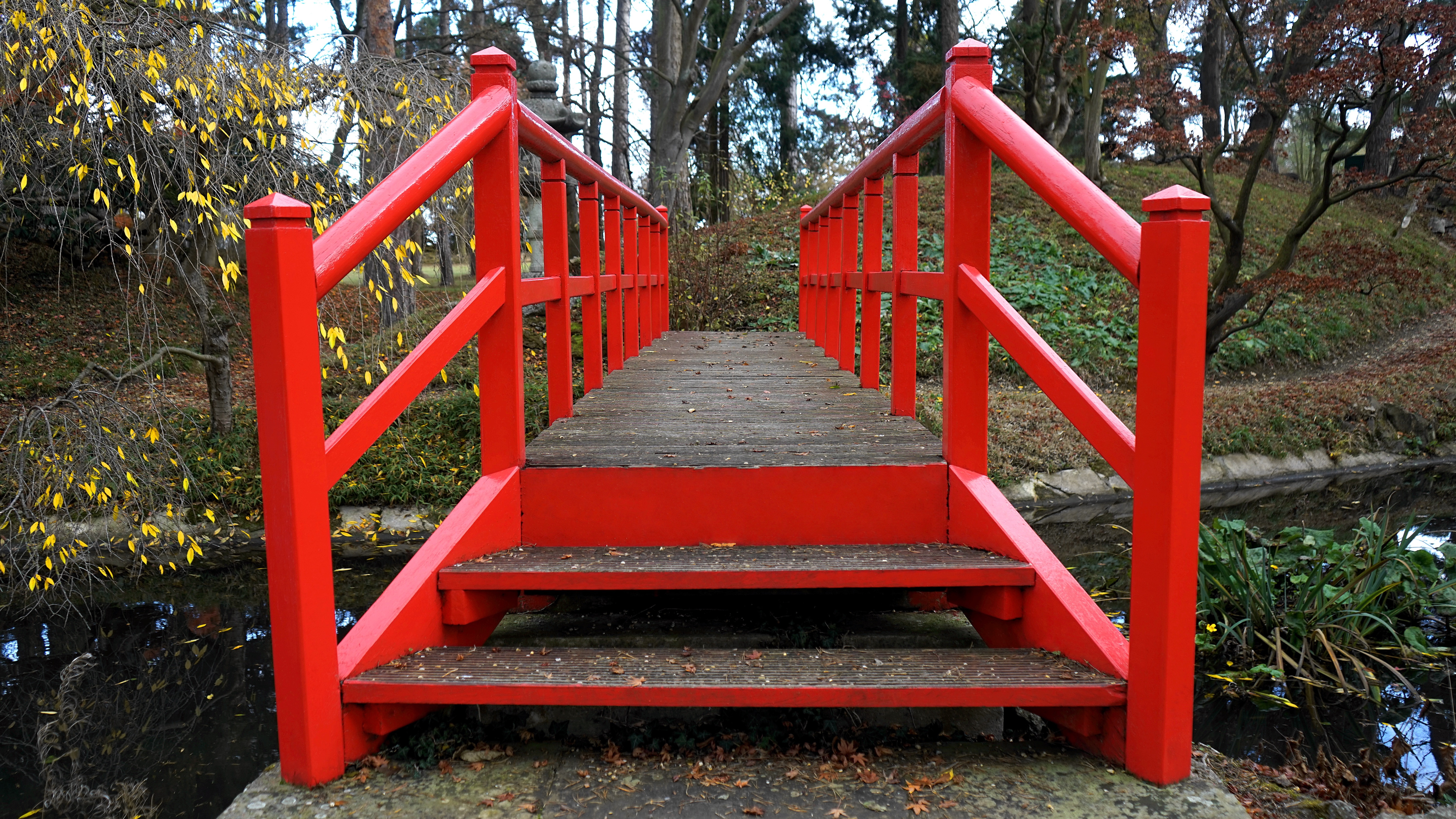 red metal path bridge