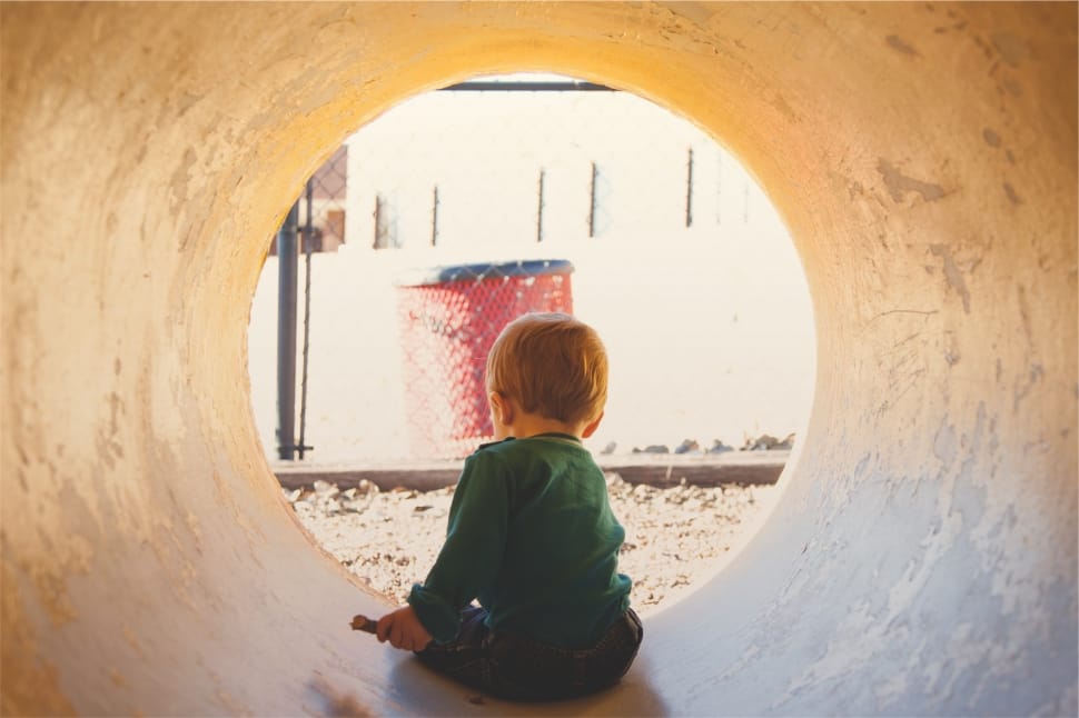 toddler inside concrete tunnel preview