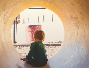 toddler inside concrete tunnel thumbnail