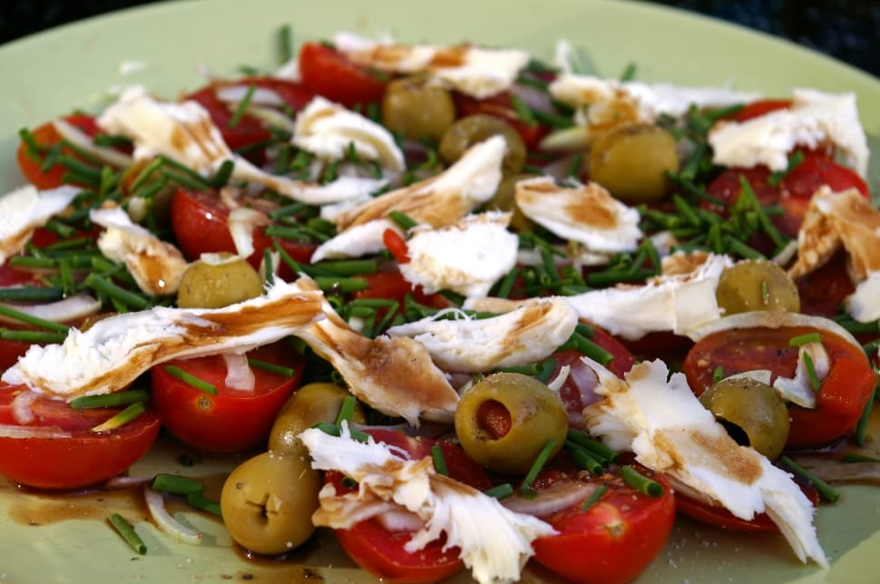photography of tomato salad with olives topped with chicken chunks preview
