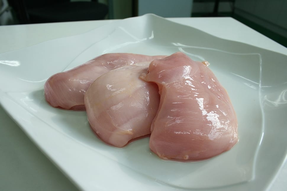 three raw chicken on white ceramic plate preview