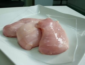 three raw chicken on white ceramic plate thumbnail