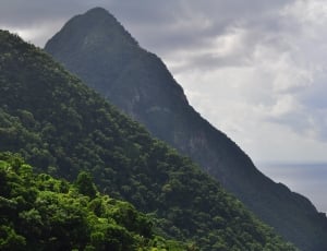 green and black mountain by the sea thumbnail