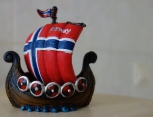 brown red blue and white galleon ship figurine thumbnail