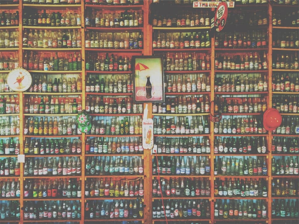 liquor bottle lot in brown wooden shelf preview