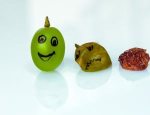 oval green fruit with smiley print thumbnail