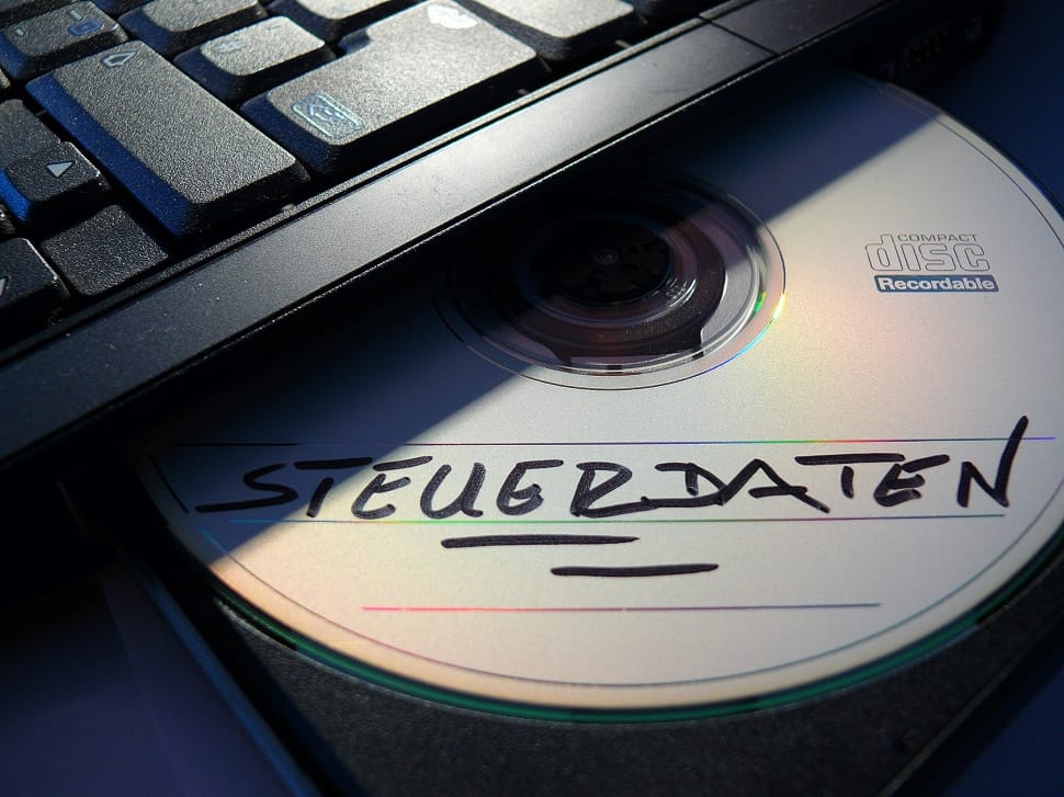 compact disc with steuerdaten text written on it on laptop optical drive preview