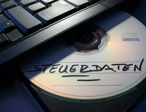 compact disc with steuerdaten text written on it on laptop optical drive thumbnail