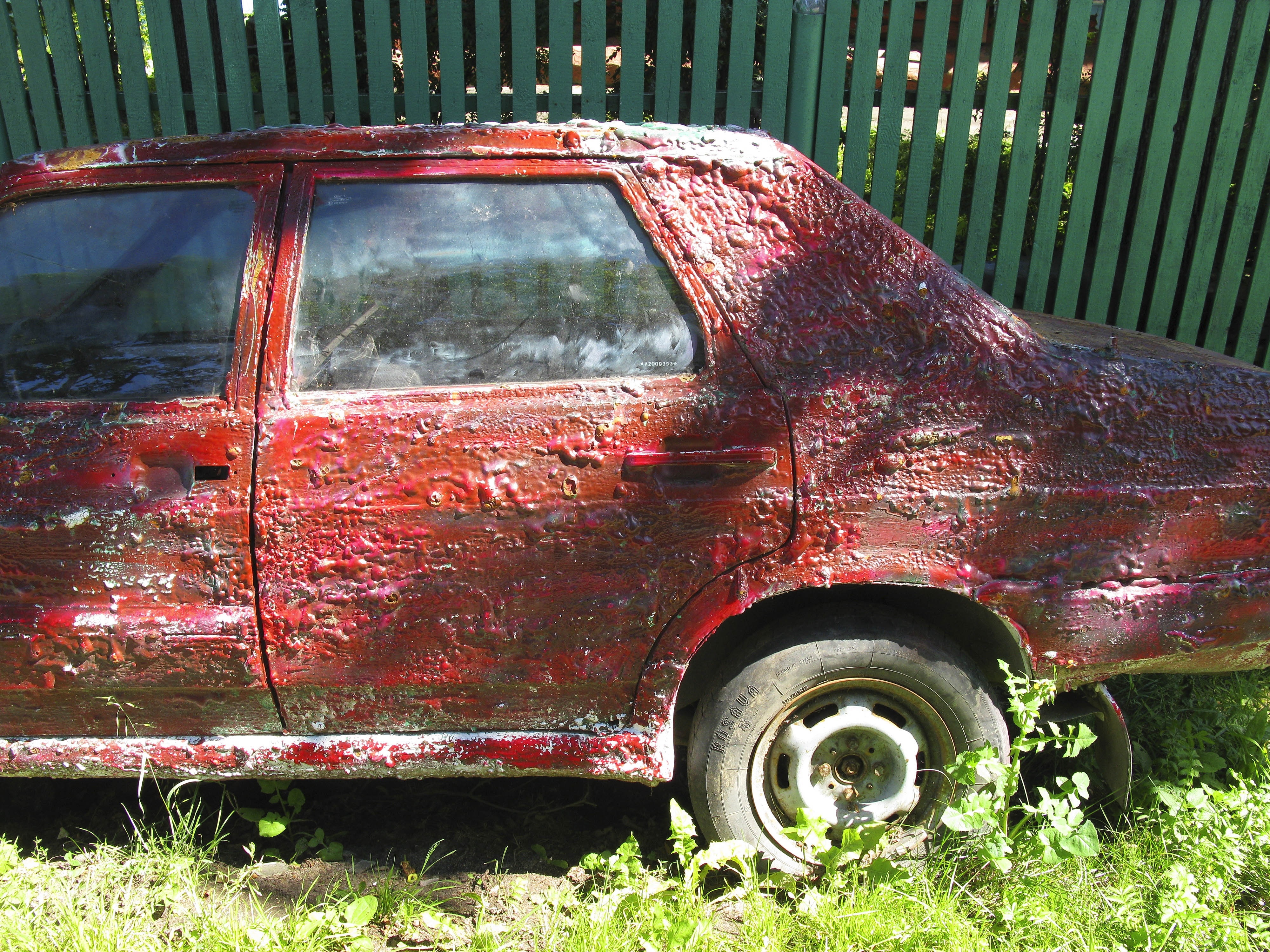 rusty red sedan