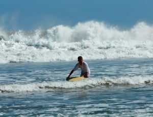 men's yellow surfboard thumbnail