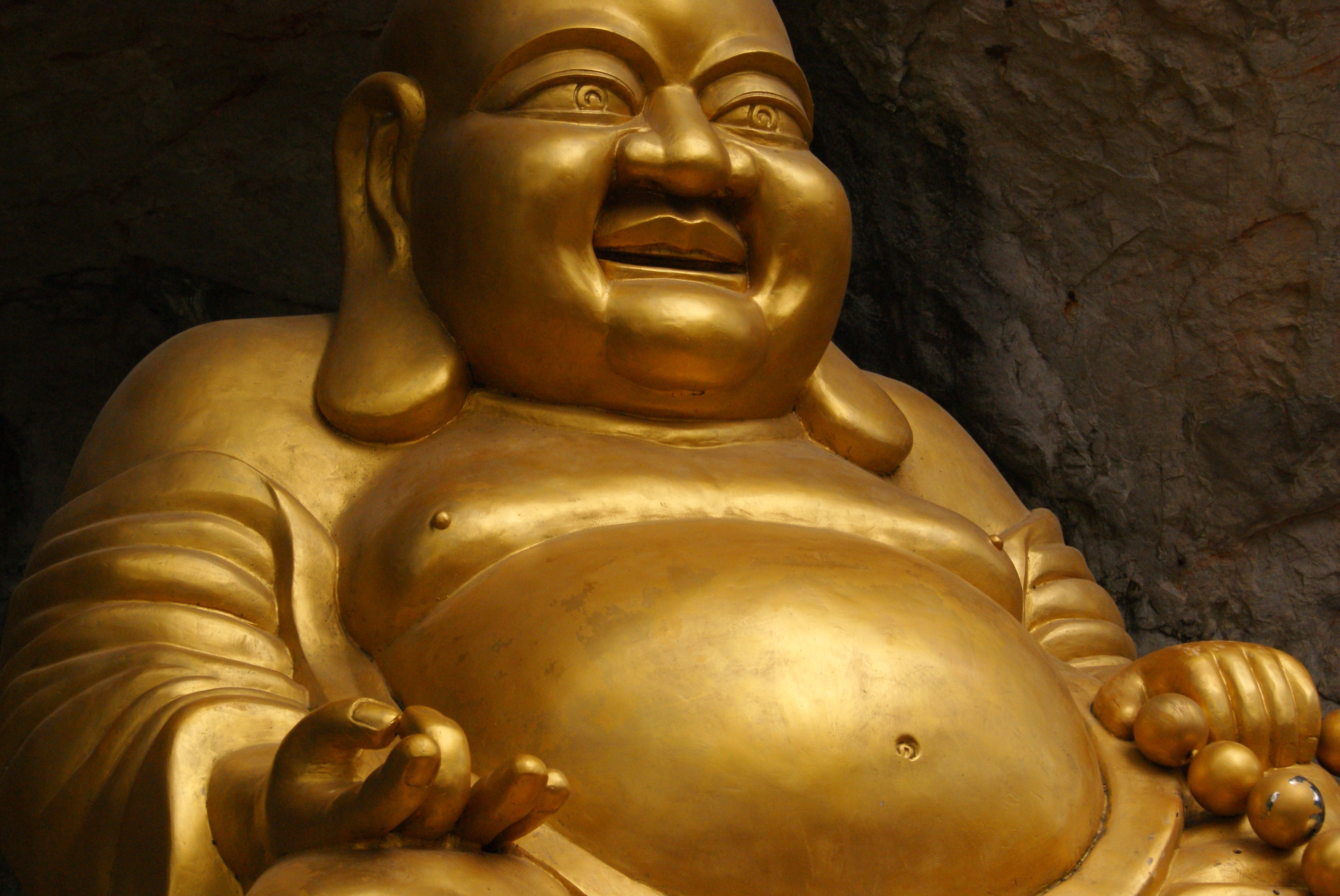 hotei buddha gold statue