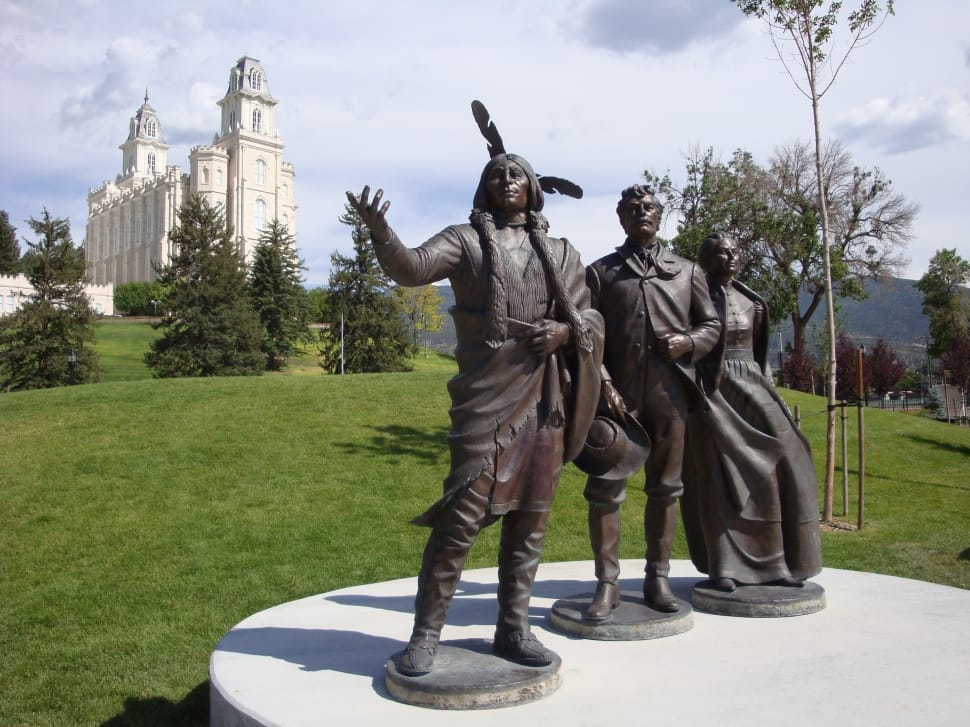 statue of native american near man and woman statue preview