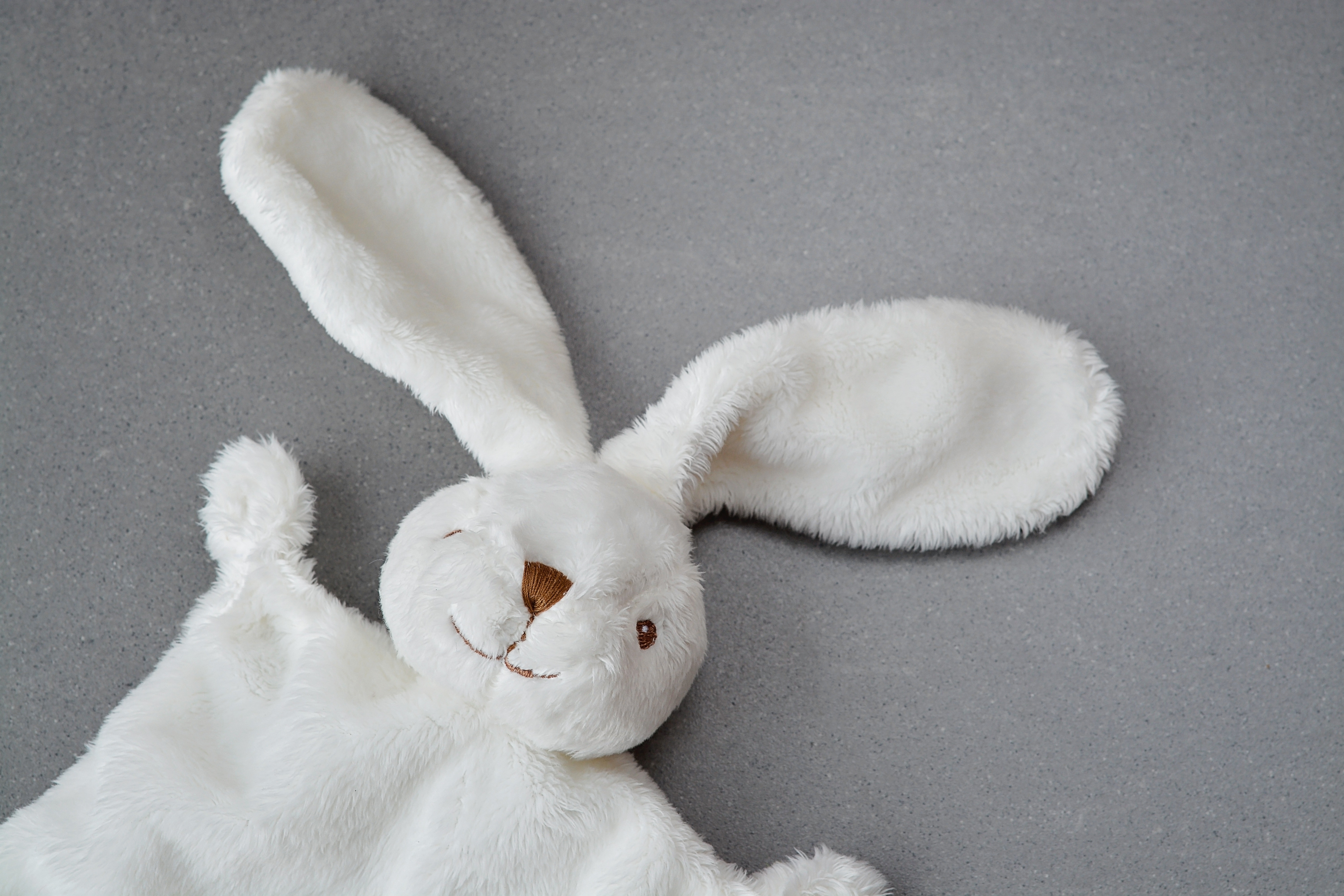 white rabbit swaddle blanket