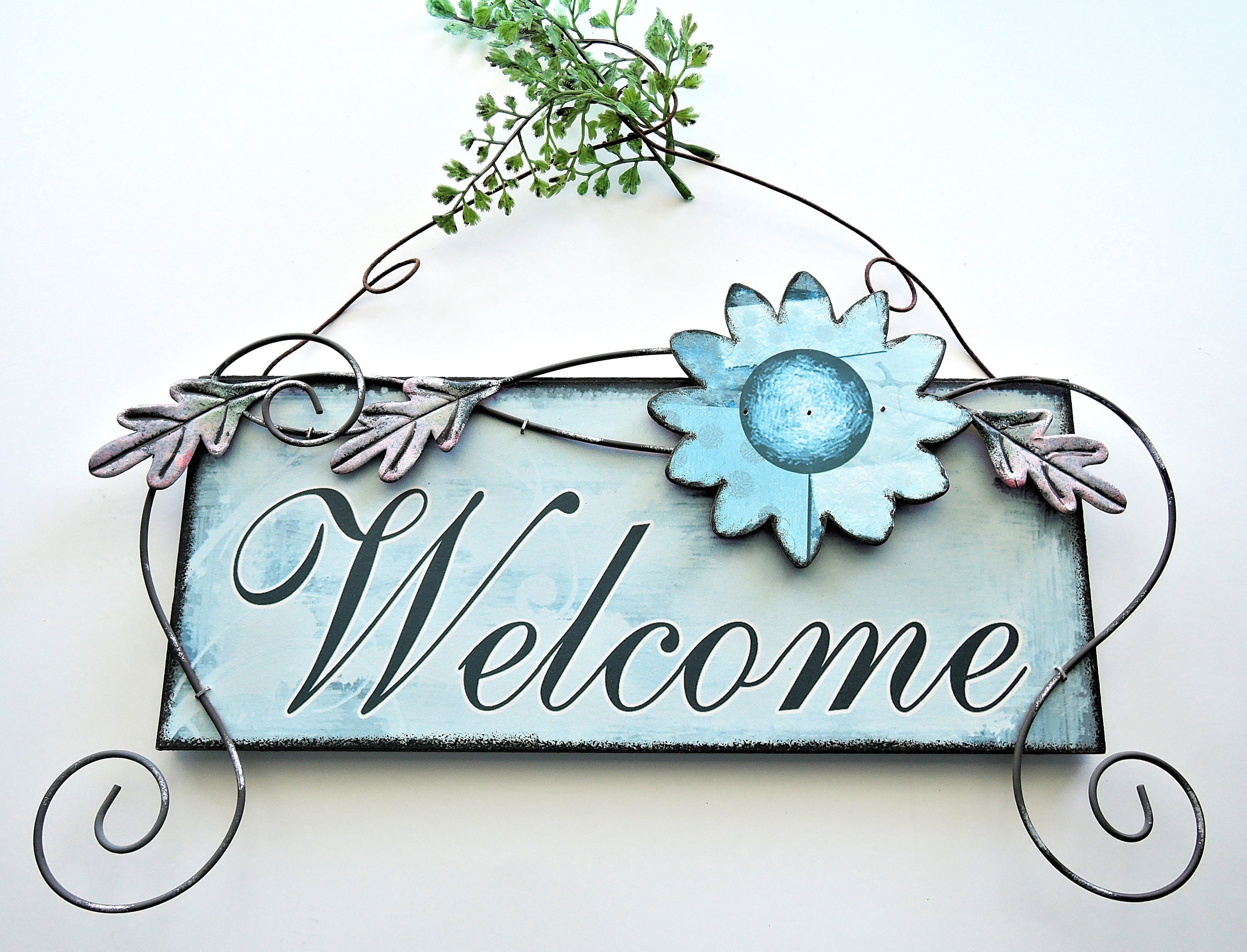 photography of blue welcome signage