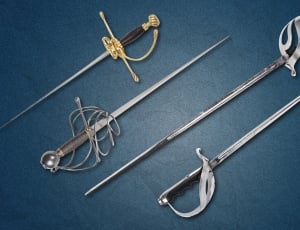 4 assorted sabres swords thumbnail