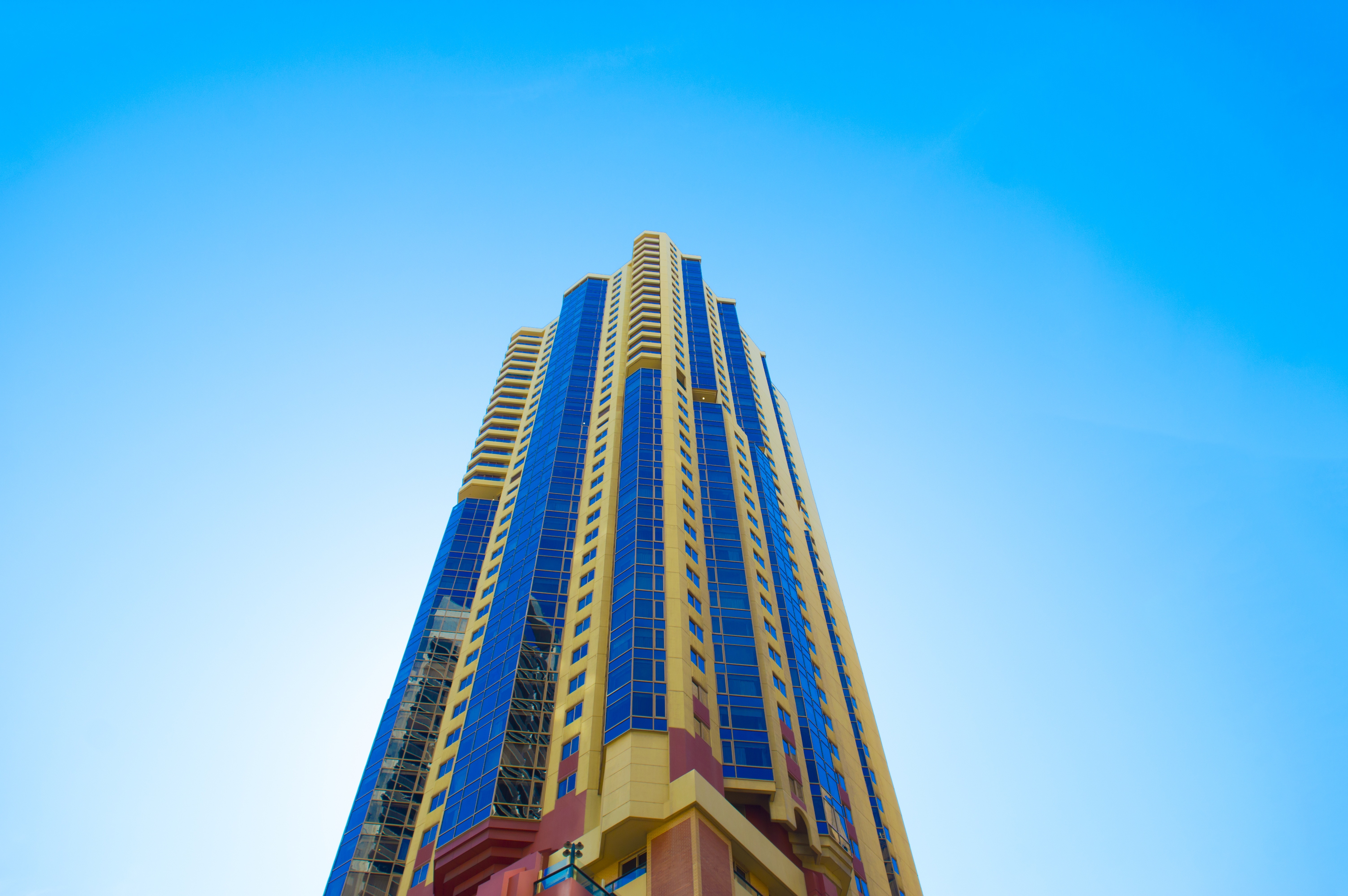 low angle view of blue and yellow commercial building