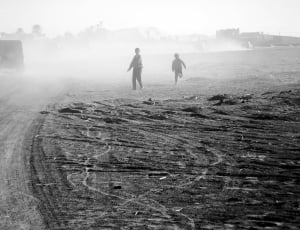 two boys on gray sands photo thumbnail