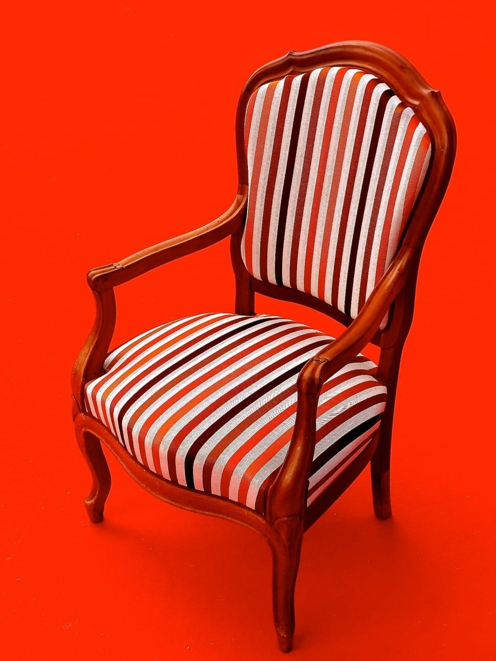 brown white and orange wooden armchair preview