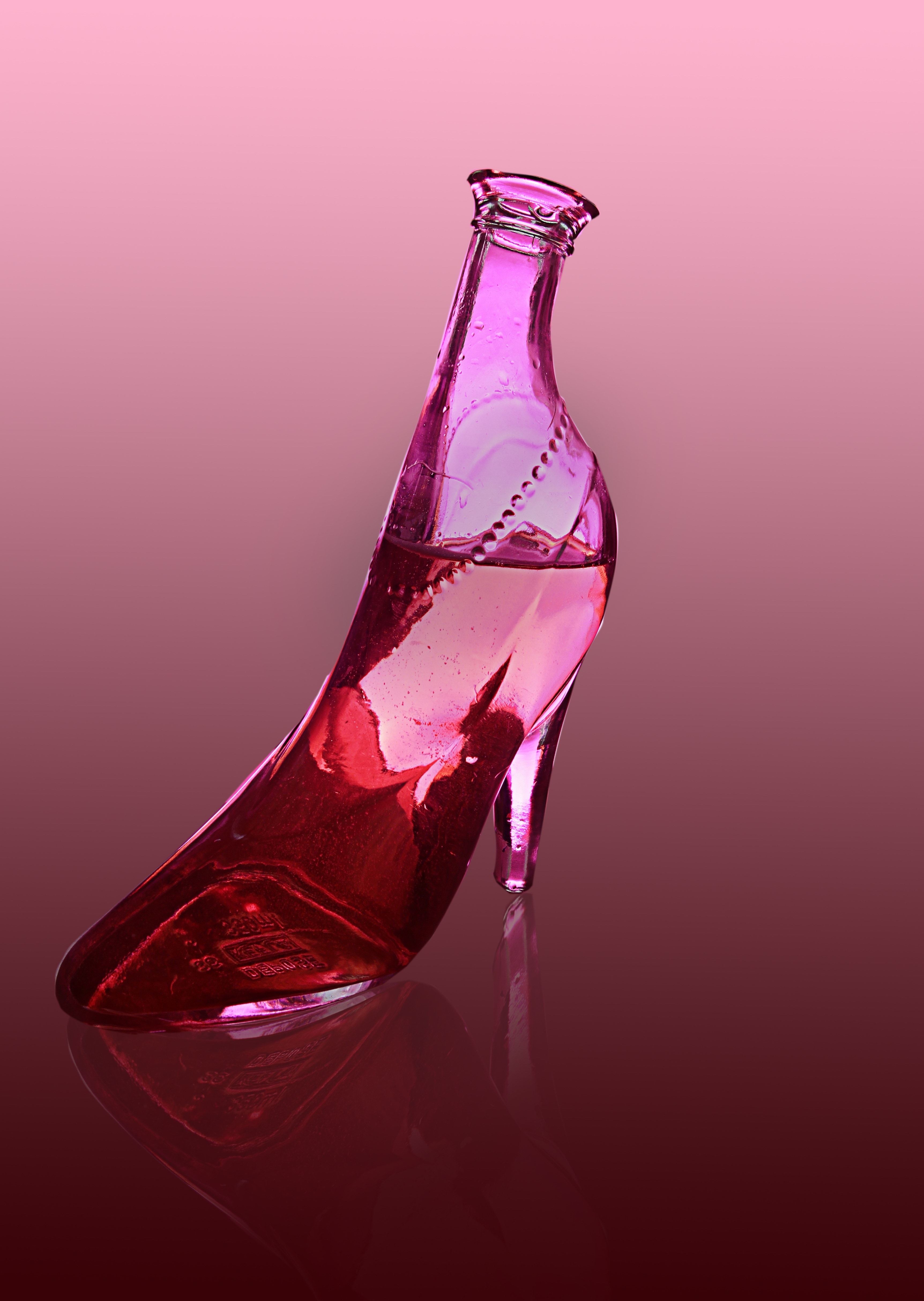 stiletto themed pink clear glass bottle