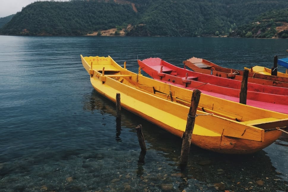 two yellow and red canoe preview