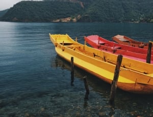 two yellow and red canoe thumbnail