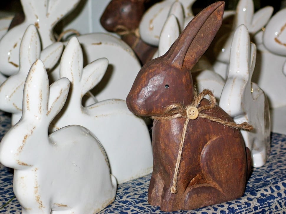 white and brown wooden rabbit sculpture lot preview
