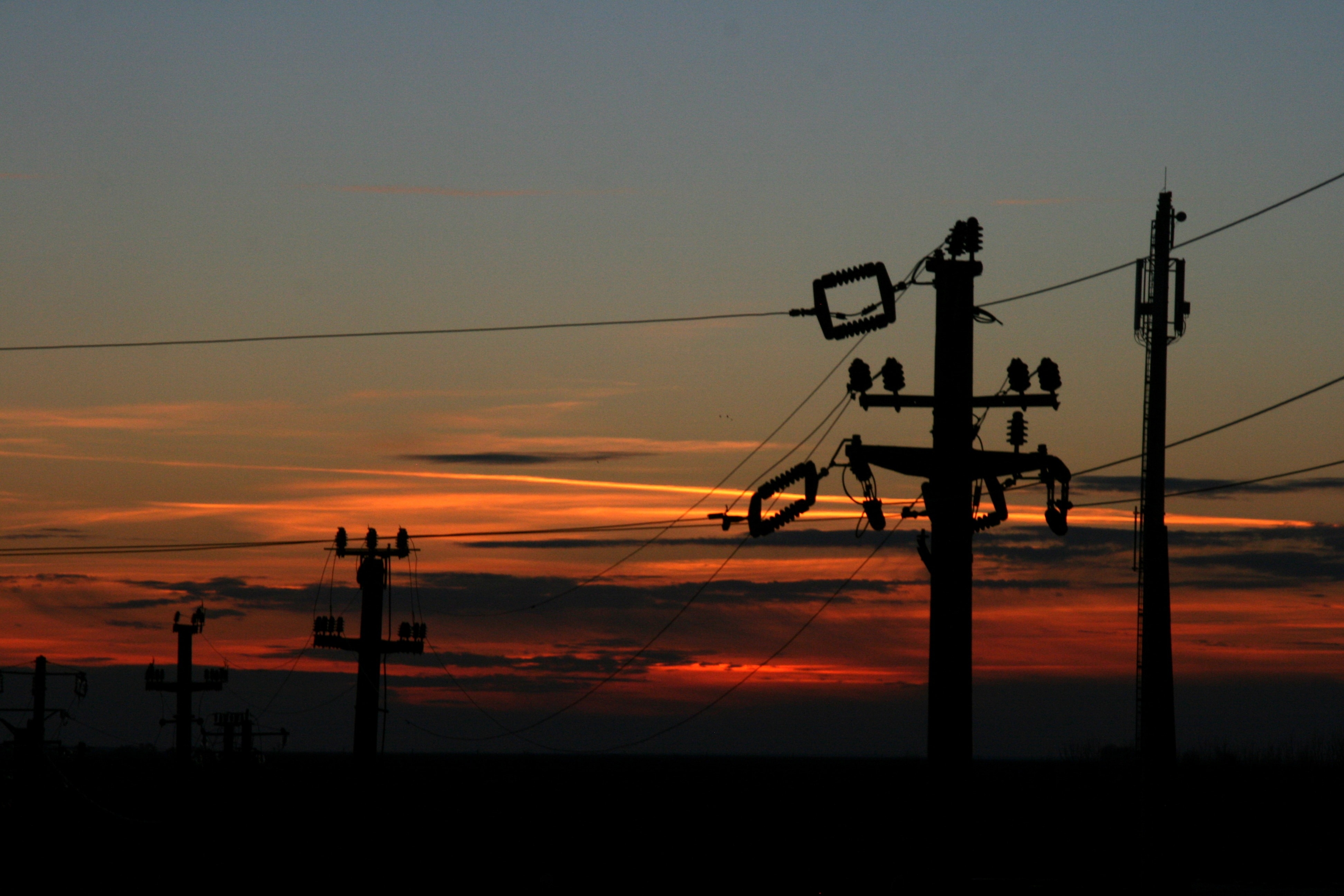 silhouette of electric post