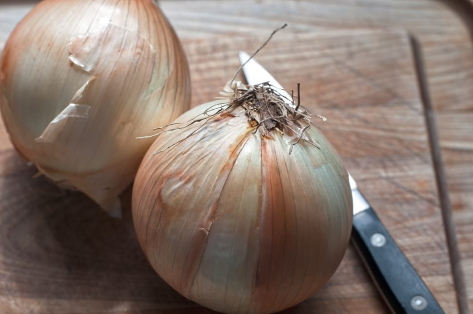 white onions on top of chopping board preview