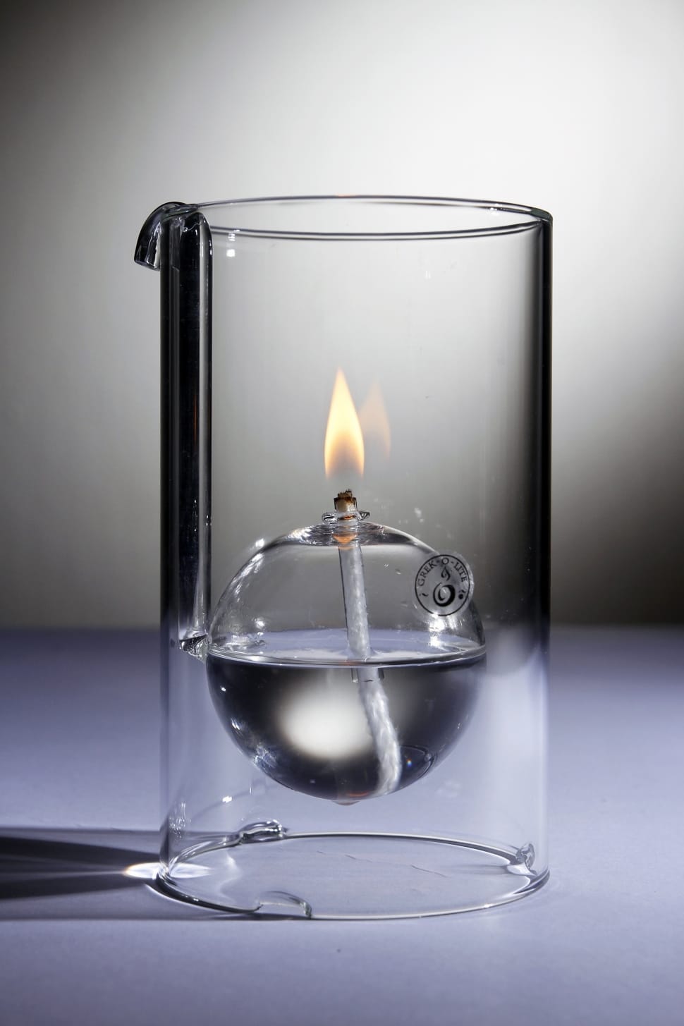 close up photo of cylindrical glass with fire preview