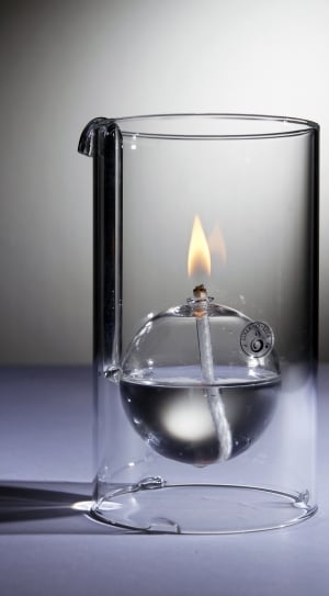 close up photo of cylindrical glass with fire thumbnail
