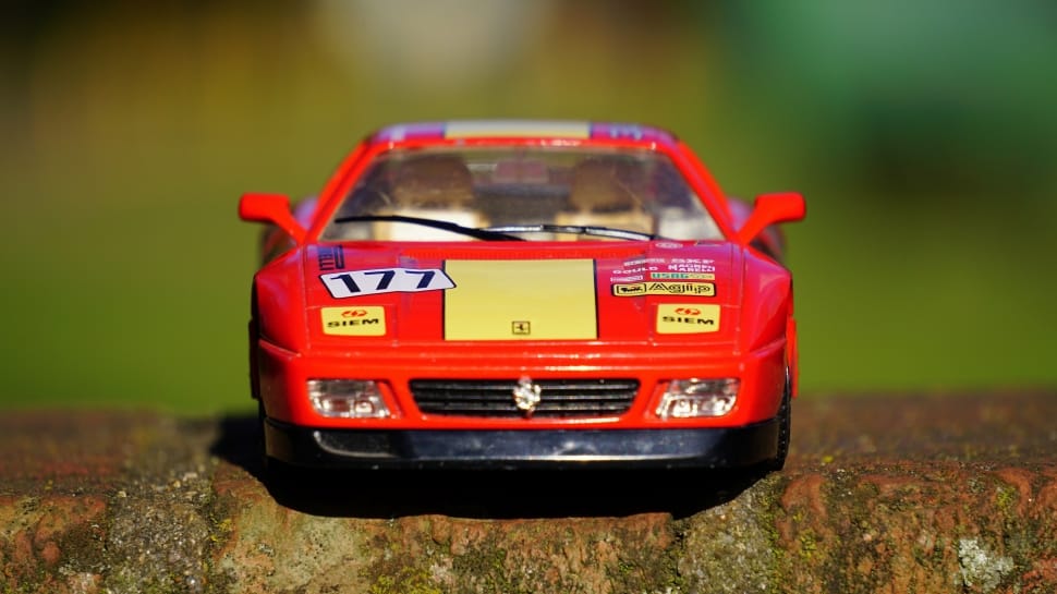 red and black race car die-cast model preview