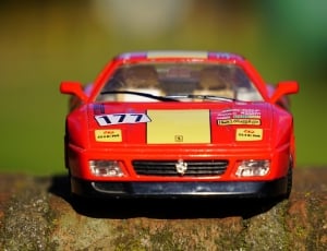 red and black race car die-cast model thumbnail