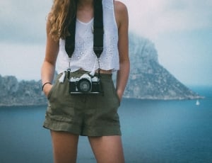 women's white crop top top and green shorts thumbnail