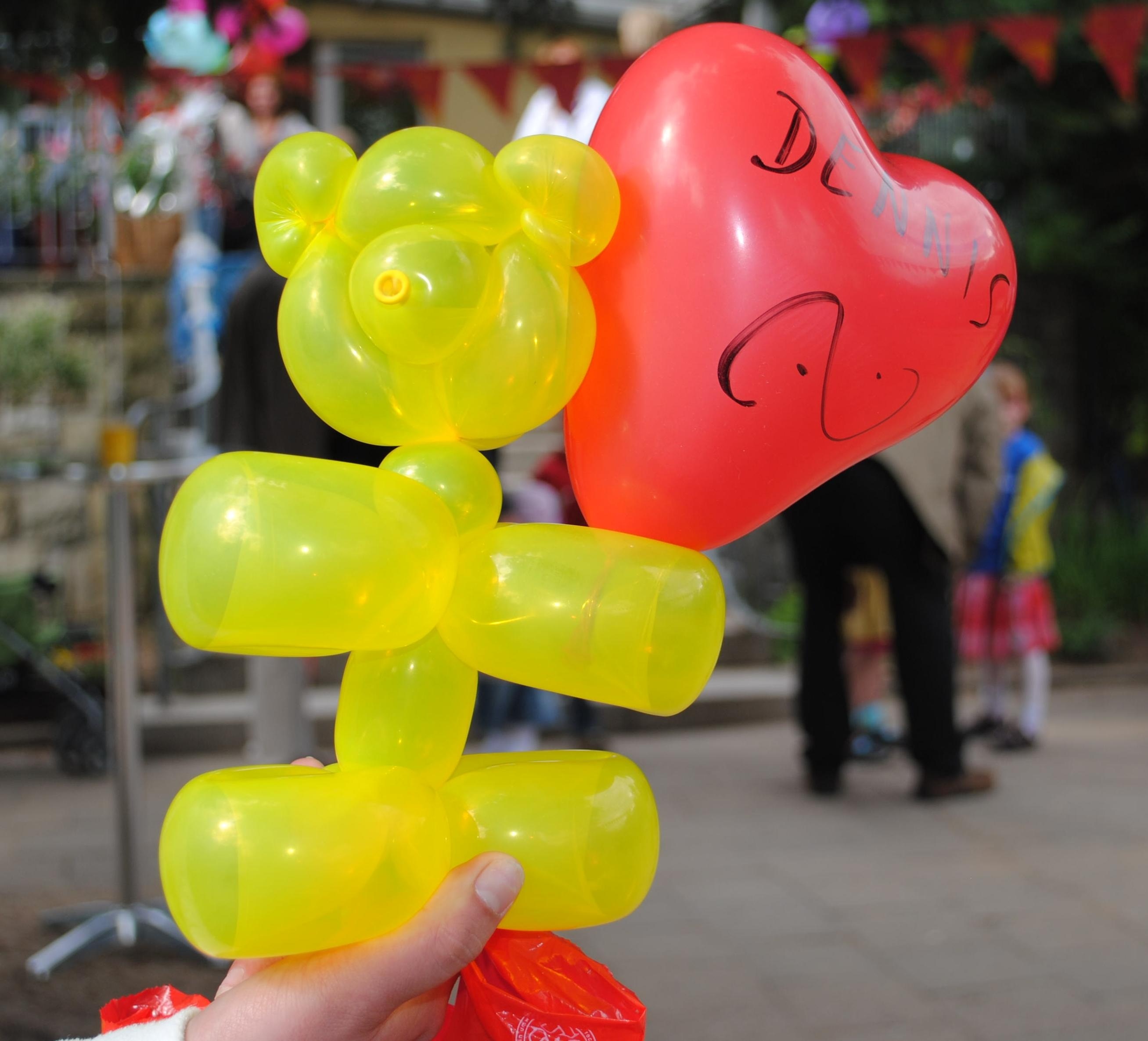 yellow and red animal shape balloon