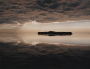 silhouette of island during daytime thumbnail