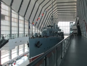 white and gray ship inside white building thumbnail