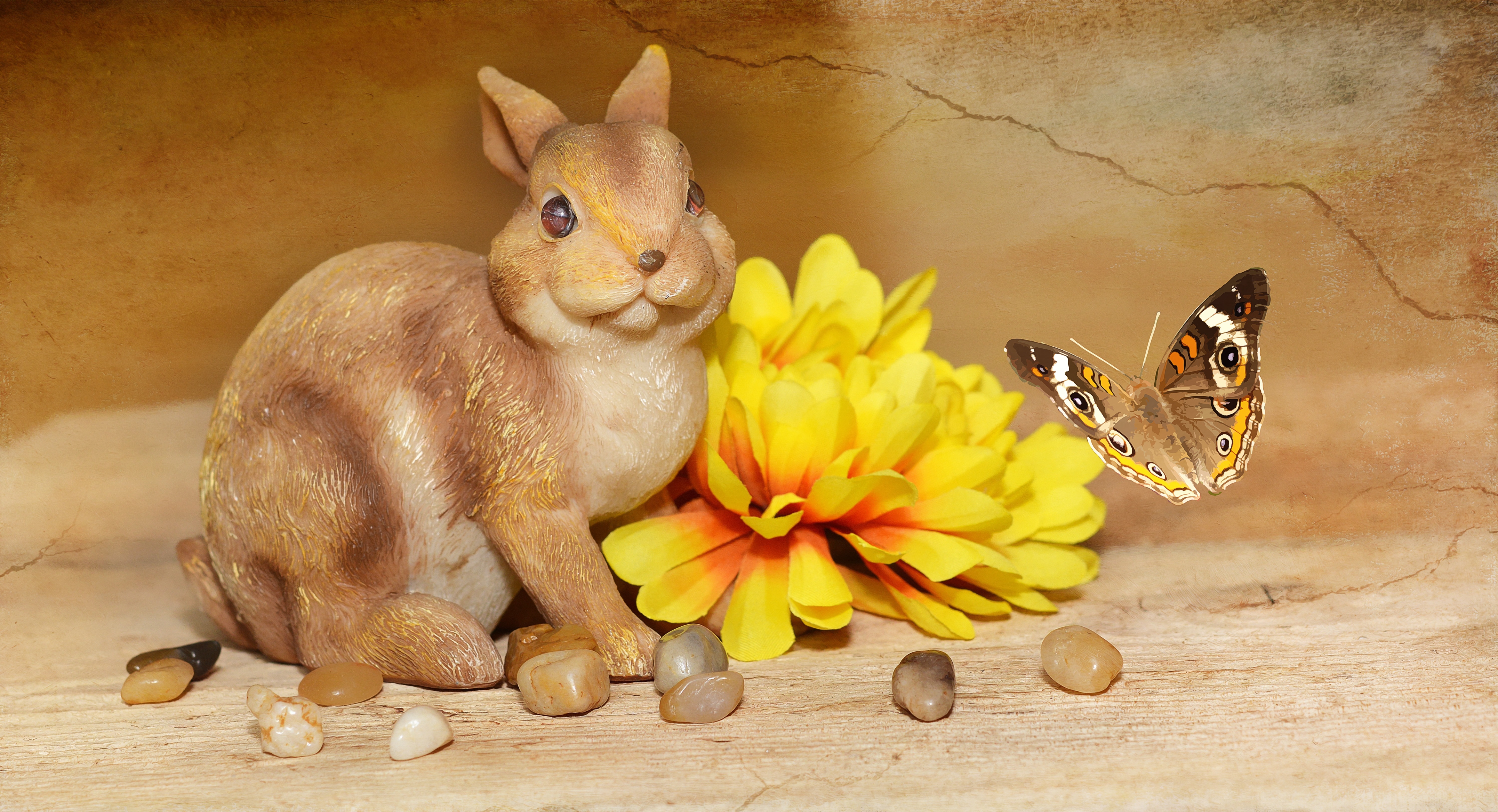 brown and beige ceramic rabbit figurine