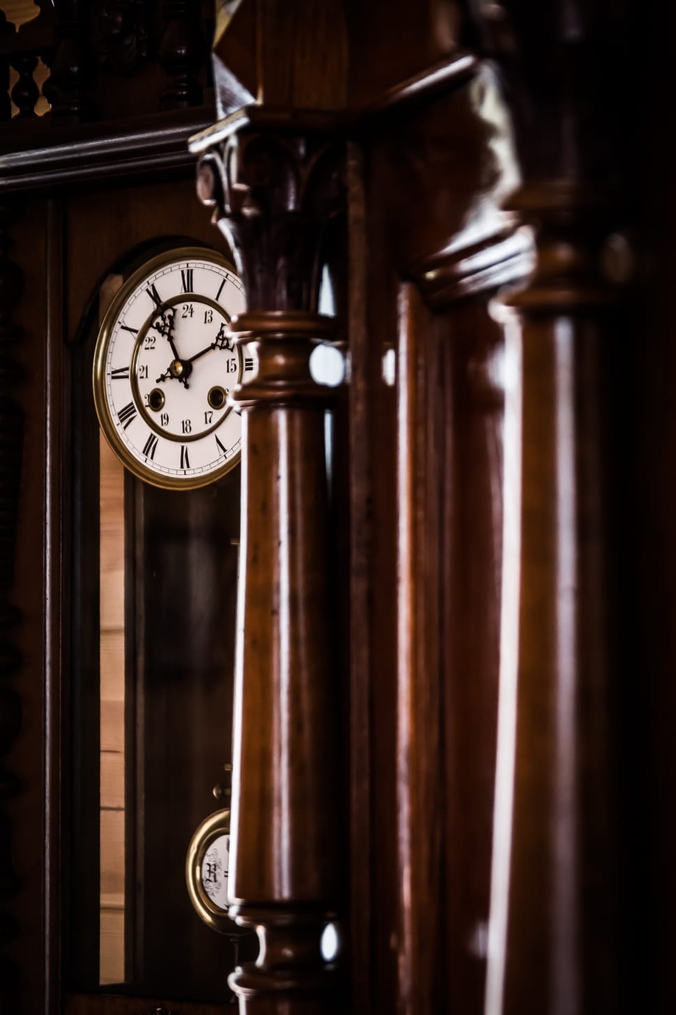 brown wooden grandfathers clock second person view photography preview